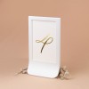 Numery stołów weselnych ze złotym wykończeniem w białej ramce - Nirvana, Ecru Pocket, Glamour Ecru Case