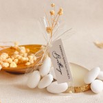 Podziękowania dla gości na Komunię – migdały w woreczku z personalizowaną przywieszką