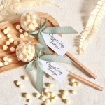 Podziękowania dla gości na Chrzest - Grzechotka boho z mlecznymi drażetkami